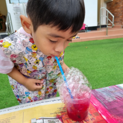 Lorenzo enjoying bubble printing .