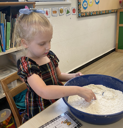 Regan tracing her name.