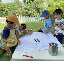 Drawing under the tree.