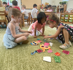 Girls playing mix and match the dolls.