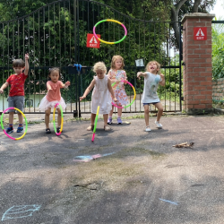 Rolling hula hoops.