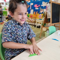 Luca making paper aeroplane