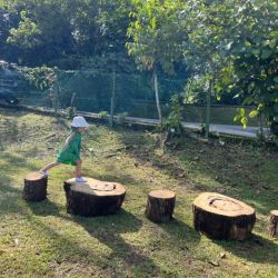 Eve -) working on counting and outdoor play, she loves the logs obstacle!