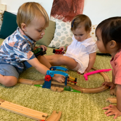 Raif, Victoire and Alli building a train track together!