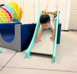 Charlie’s found a new way to go down the slide!