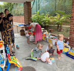 Izzy, Zeno, Leo, Maya, and Victoire checking out the toy/book sale!