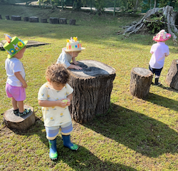 Seb, Hugo, Archer and Romy looking for eggs around the tree trunks!