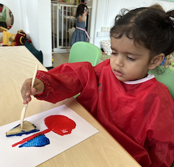 Una creating her boat using a potato