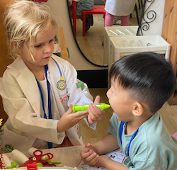 Dr. Louise giving a dose of medicine