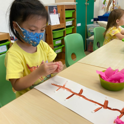 Ena sticking the “cherry blossom” for her art work