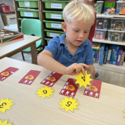 Henry playing a numeracy game “fire cracker”