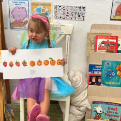 Izzy shares “the hungry caterpillar” story with her friends!