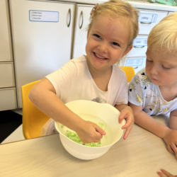 Louise helping to mix the ingredients .