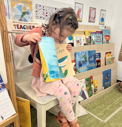 Vivi reading her favorite book.