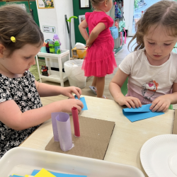 Paige & Lily creating paper scultpers