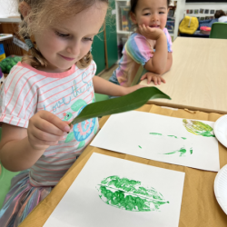 Cassie loving her leaf printing art