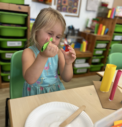 “I can see you” Izzy creating her paper sculpture