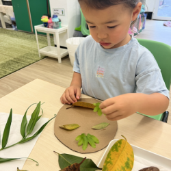 Myla working on her earth collage.