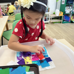 Ena working with different papers.