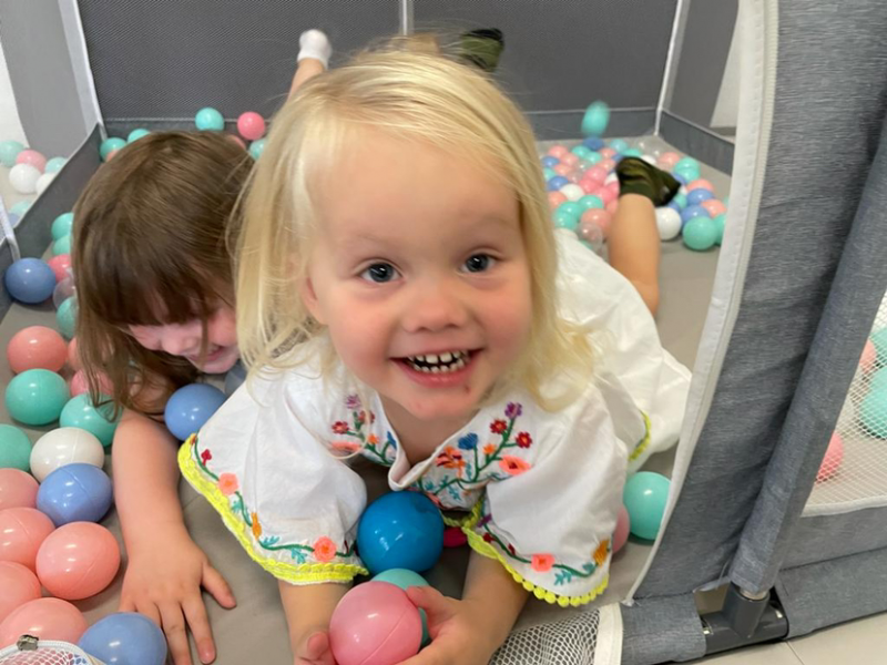 Alex having fun in the soft play room.