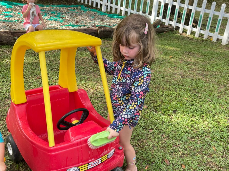 Clemmie is washing up the car