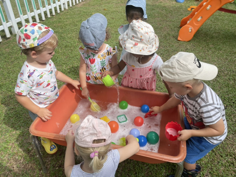 Dylan, Margot, Alex, Monty and Kaavya enjoying the water table.