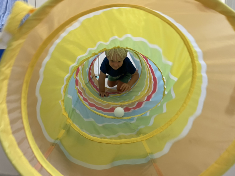 Henry crawling through the tunnel.