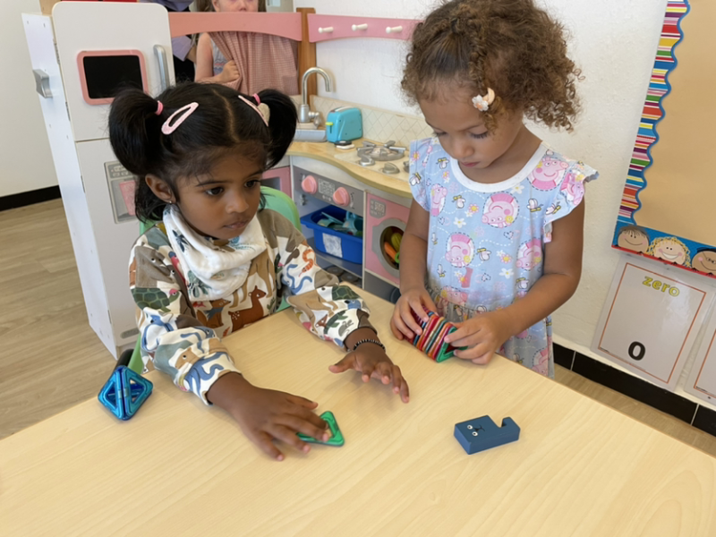 Kaavya and Lydia playing together during free play.