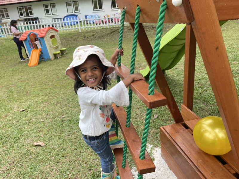 Kaavya climbing on the pirate ship.