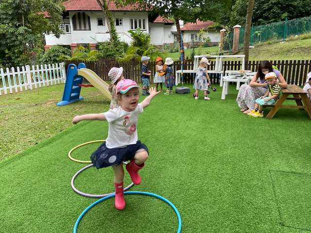 Lily jumping through the hoops.