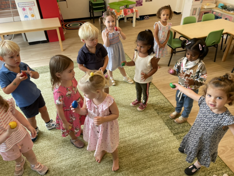 Music and dancing time. Using the egg shakers and dancing to The Freeze Song.
