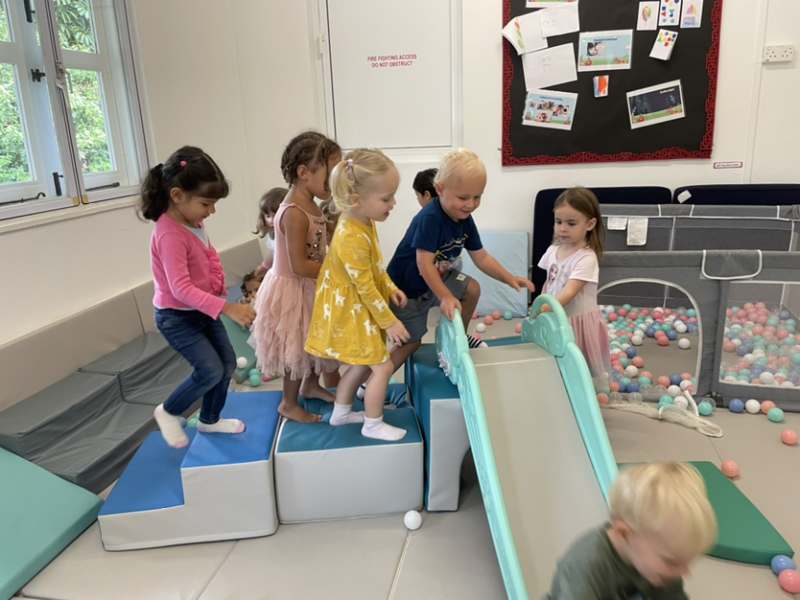 Taking turns in the soft play room.