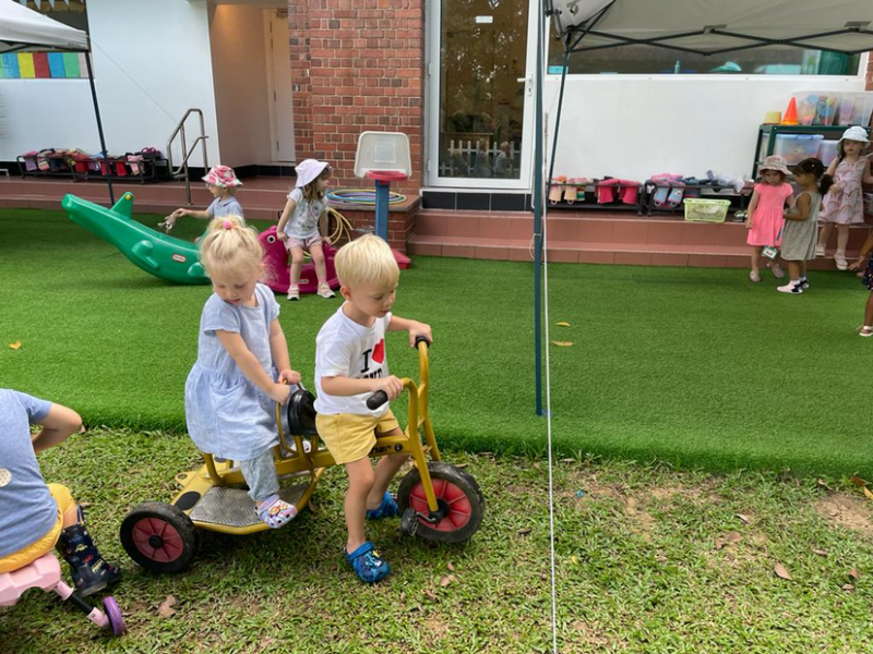 Team work! Alex and George working together to ride the bike.