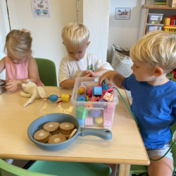 Alex, George and Henry playing with the wooden beads.