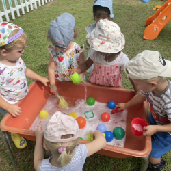 Dylan, Margot, Alex, Monty and Kaavya enjoying the water table.