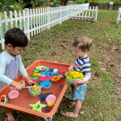 George and Isaac playing at the water table..png