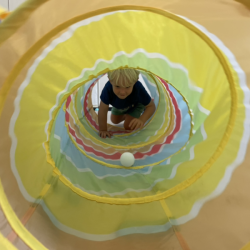 Henry crawling through the tunnel.