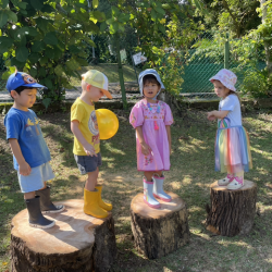 Isaac-Alara-Mia-and-George-balancing-on-the-tree-stumps.-