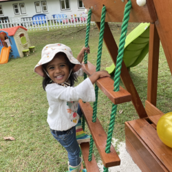 Kaavya climbing on the pirate ship.
