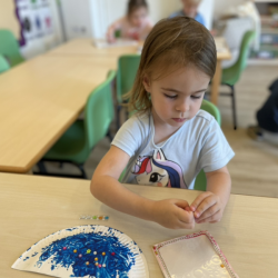 Mia decorating her diya.