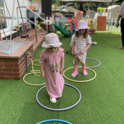 Practising-jumping-in-the-hoops-with-two-feet.-