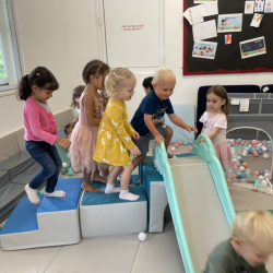 Taking turns in the soft play room.