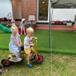 Team work! Alex and George working together to ride the bike.