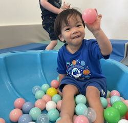 Avery enjoying the soft weather play room.