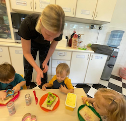 Georgia (Asher’s mum) making fairy bread with Skyler , Poppy and Raif.