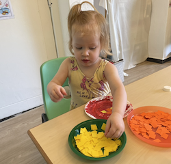 Isabelle working on her flower art.