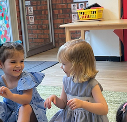Margot and Isla enjoying circle time.