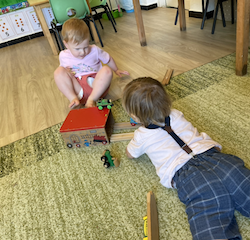 Thomas and Raif playing with the train set together.
