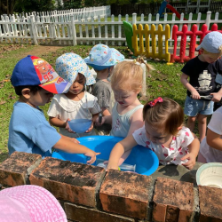 Having so much fun in the mud kitchen!