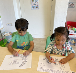 Kathavya and Allie colouring together.